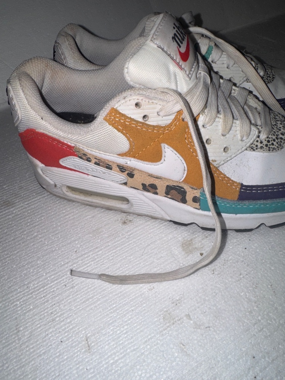 Nike Kids White Sneakers with Purple, Teal & Red Accents